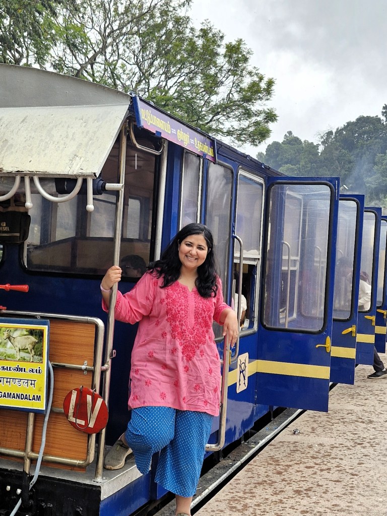 Posing against the Nilgiri Mountain Railway